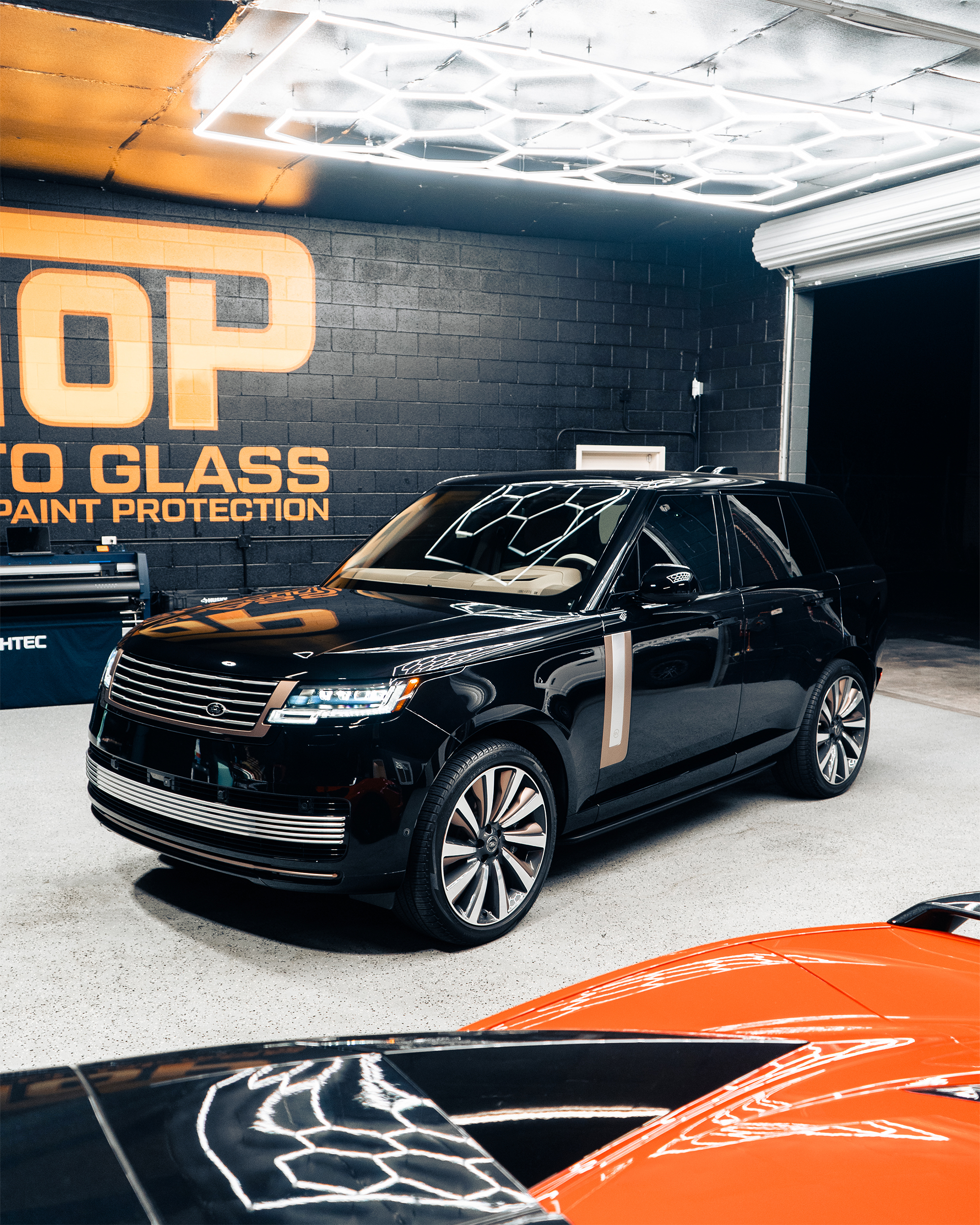 Top Auto Glass shop interior with Range Rover