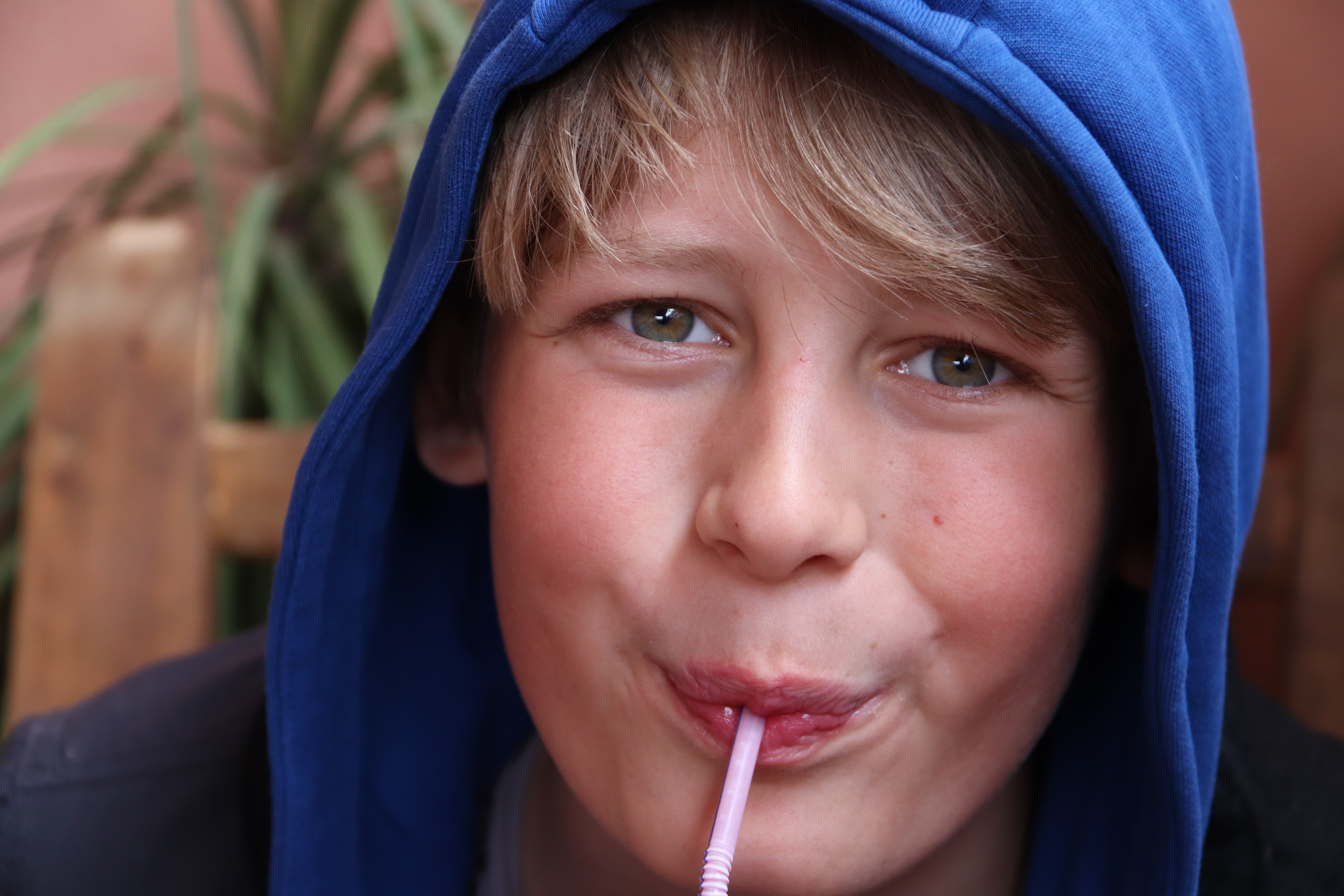 Morocco 2018 - Boy in Blue Hood Drinking with Straw