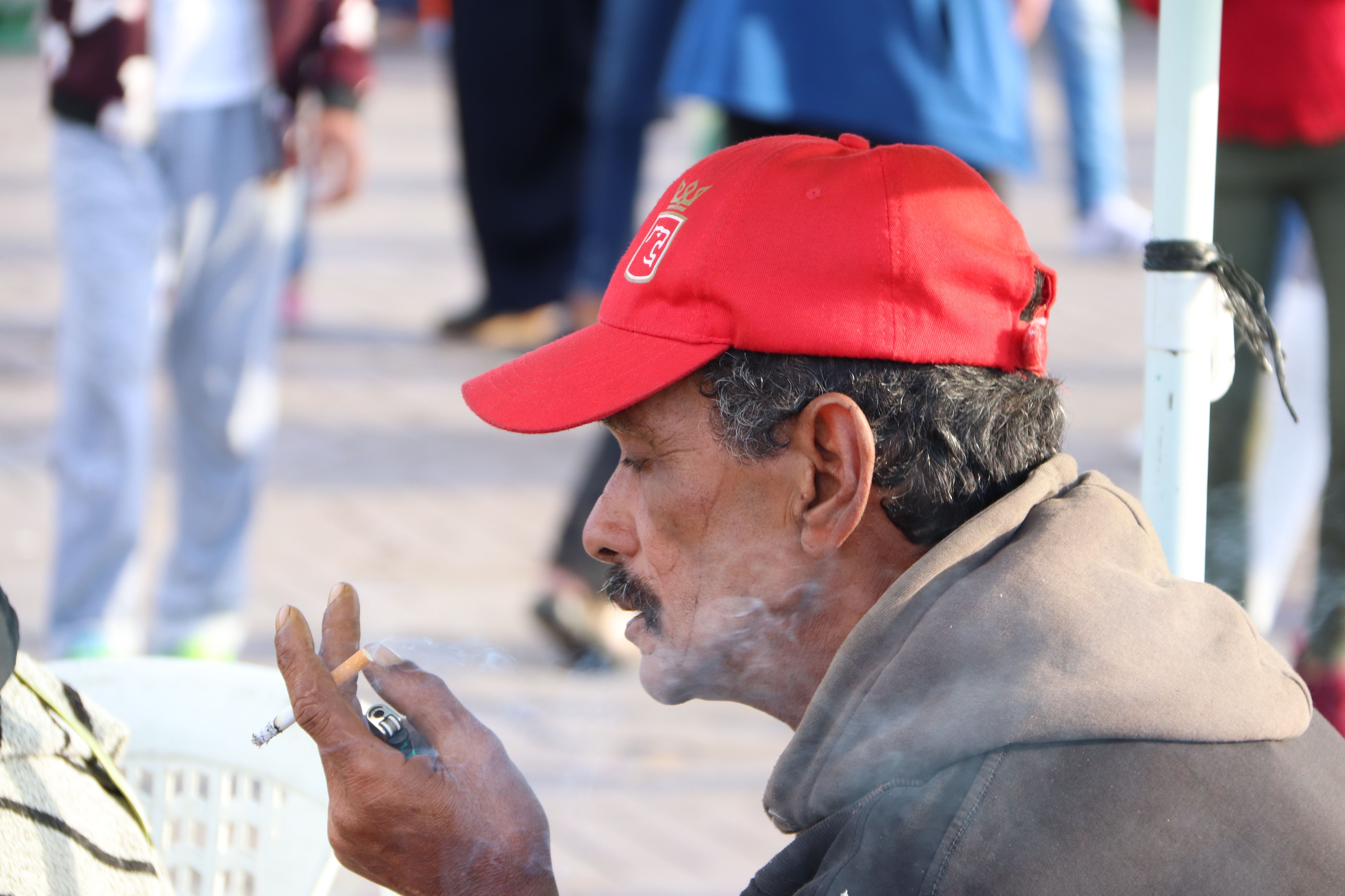 Morocco 2018 - Man in Red Cap Smoking Cigarette
