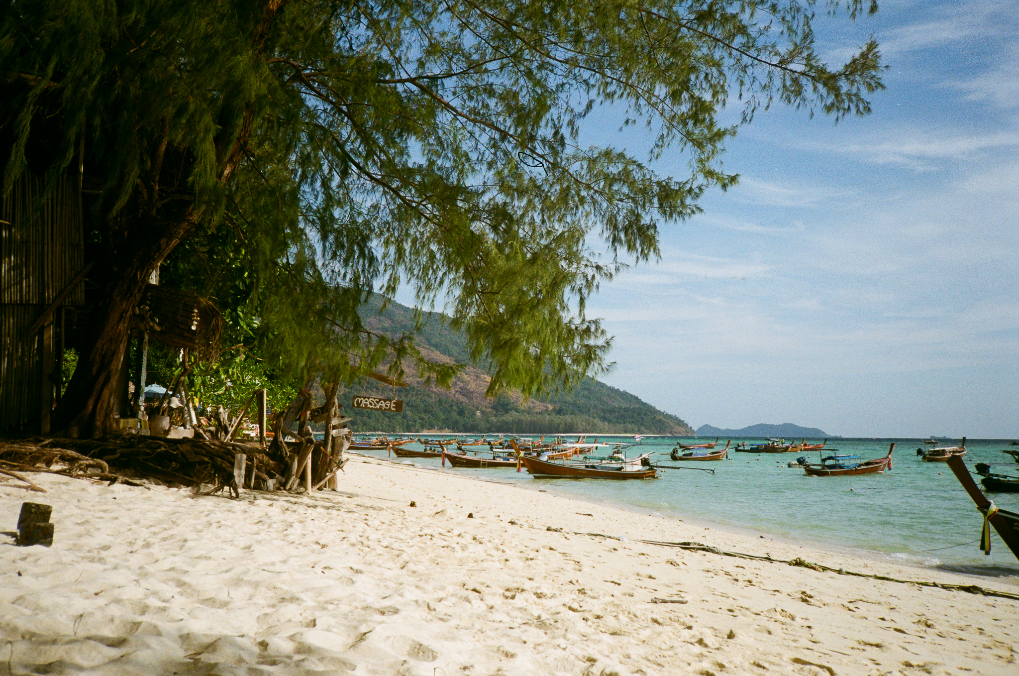 Golden moments in Thailand - Beach with Boats and Massage Sign
