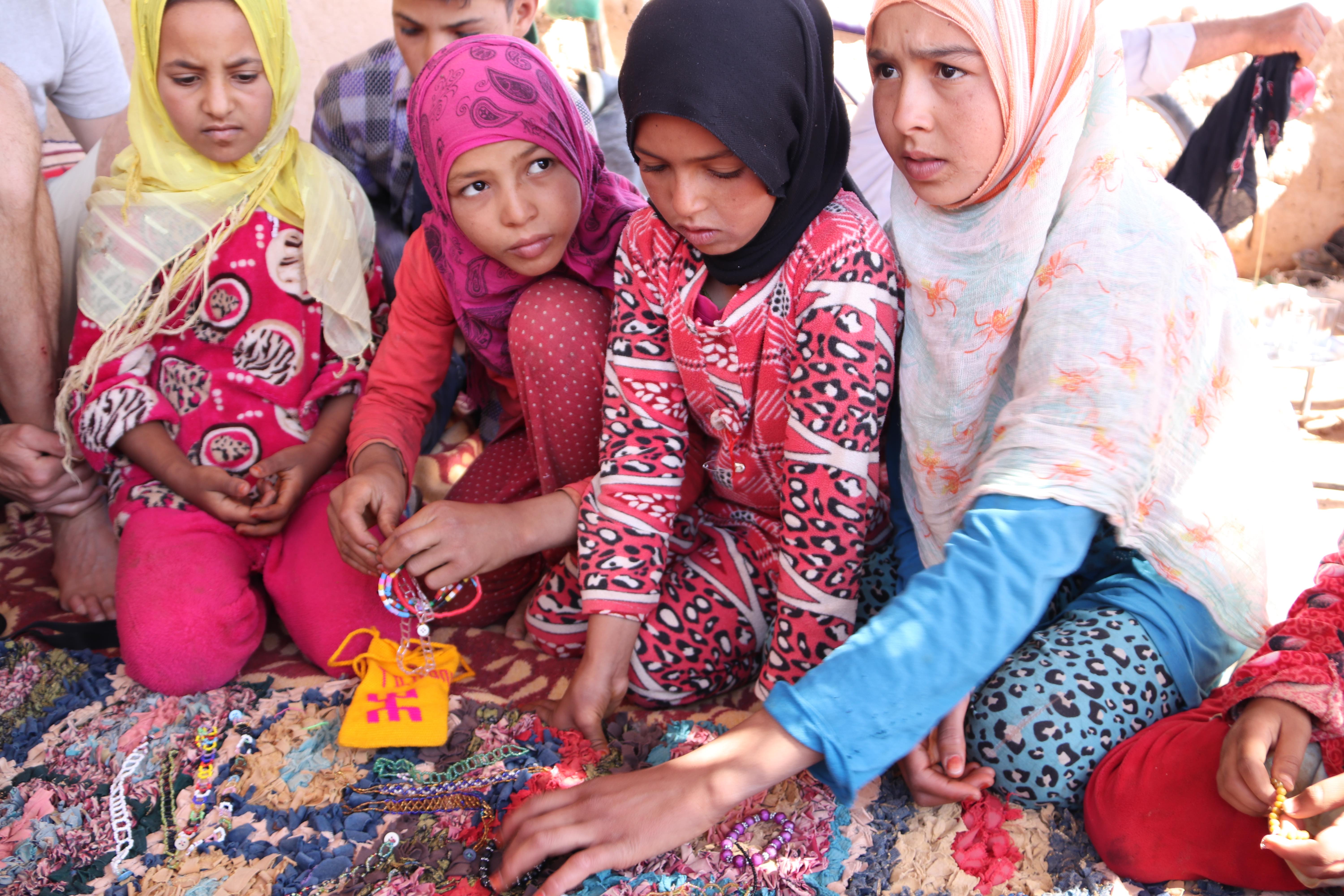 Morocco 2018 - Children Gathering Around Beaded Jewelry on Rug