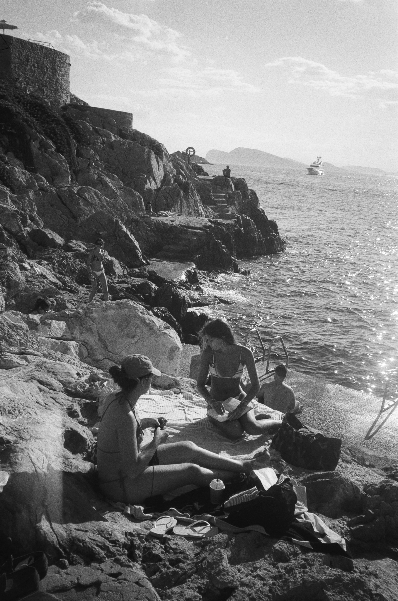 Stories of Greece - People on Rocky Beach B&W