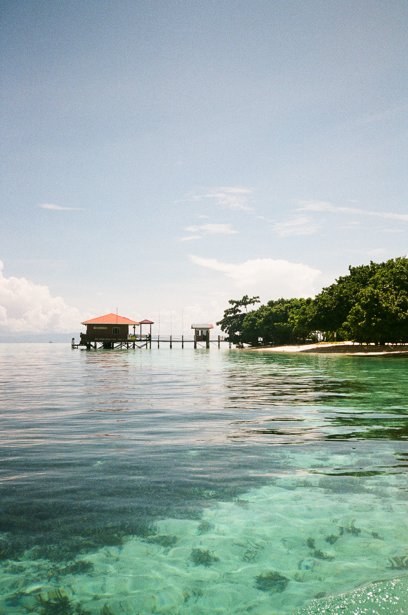 People of the Sea - Stilt Houses on Clear Water
