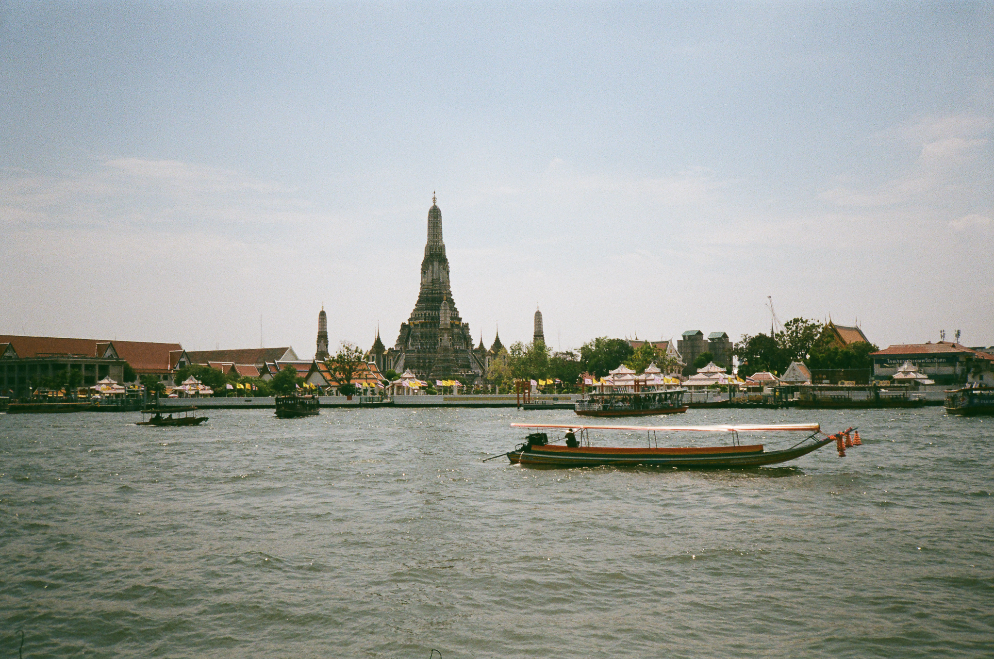 Golden moments in Thailand - Wat Arun from River with Longtail Boat