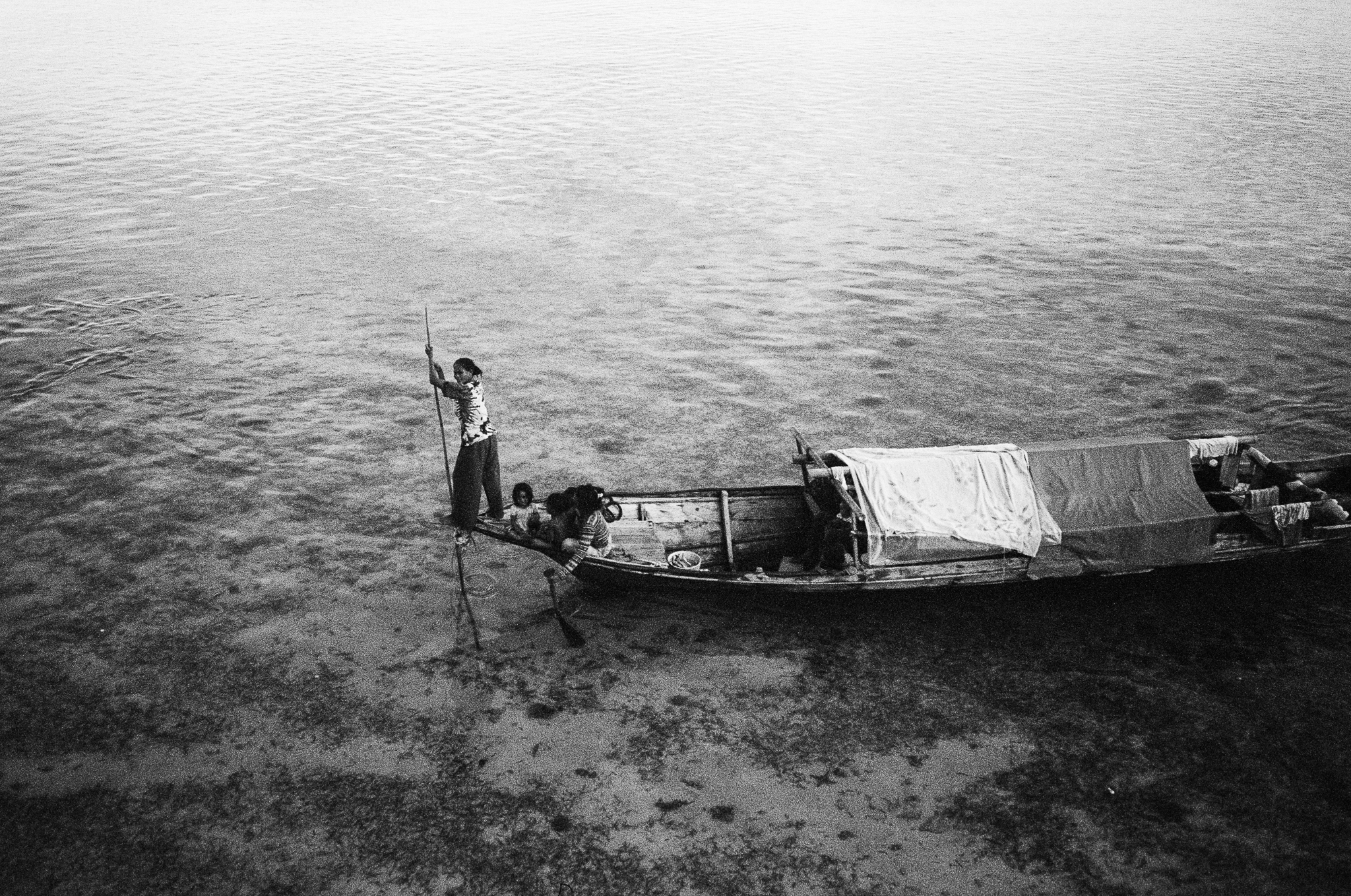 People of the Sea - Woman Poling Boat