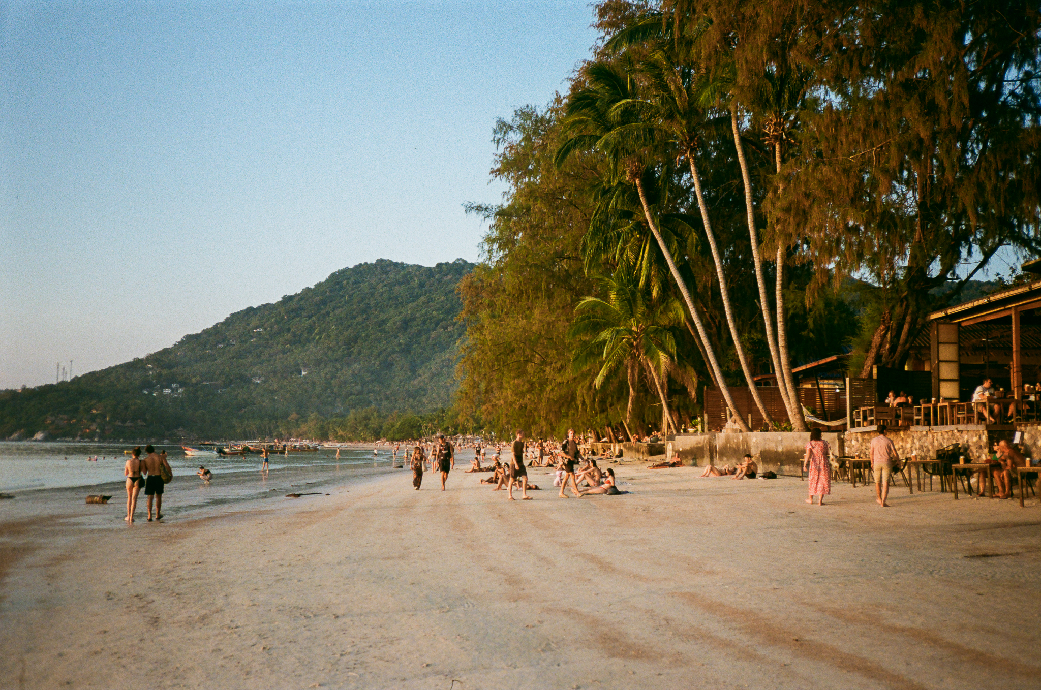 Golden moments in Thailand - Beach at Sunset with People
