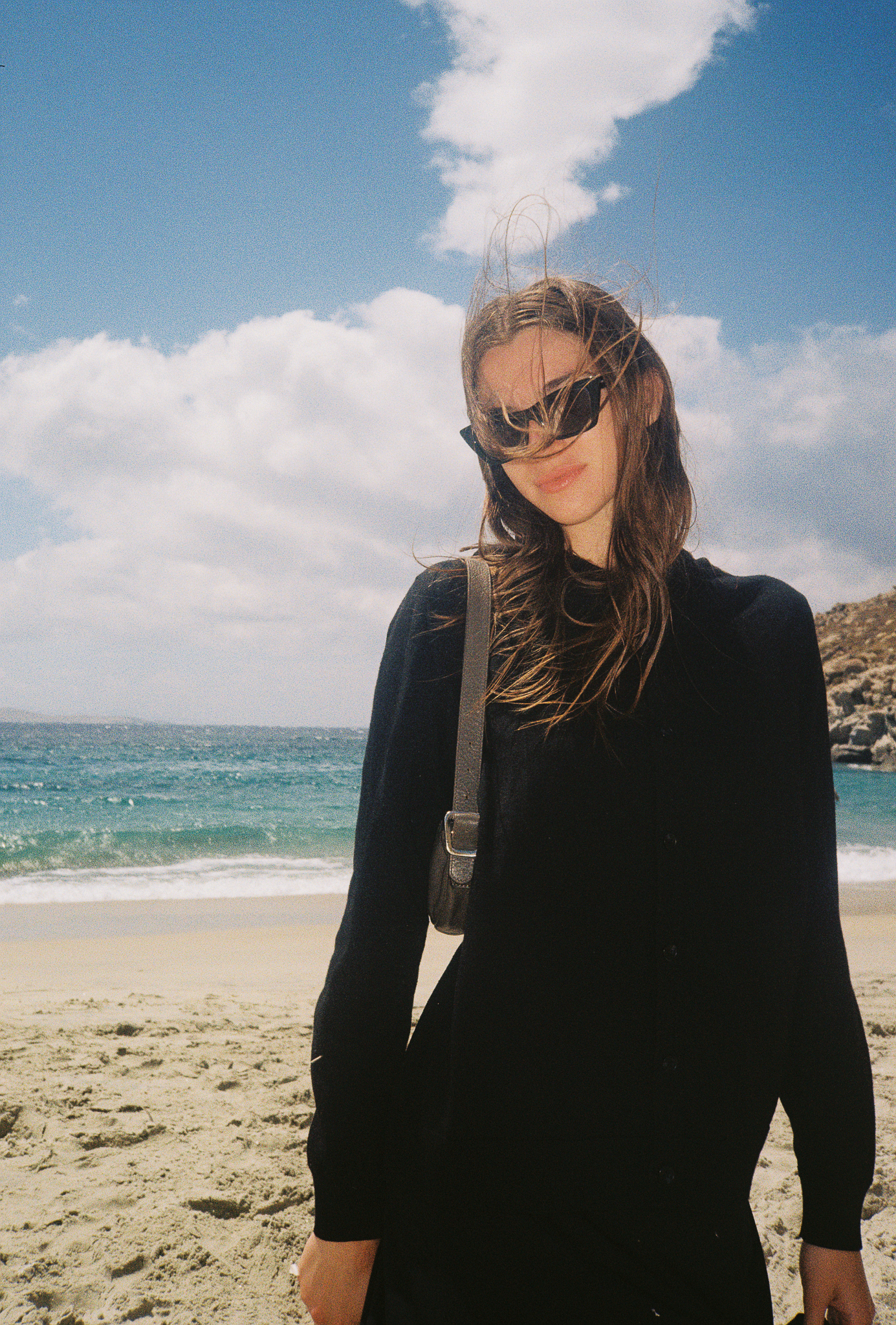Stories of Greece - Woman in Black Dress on Beach