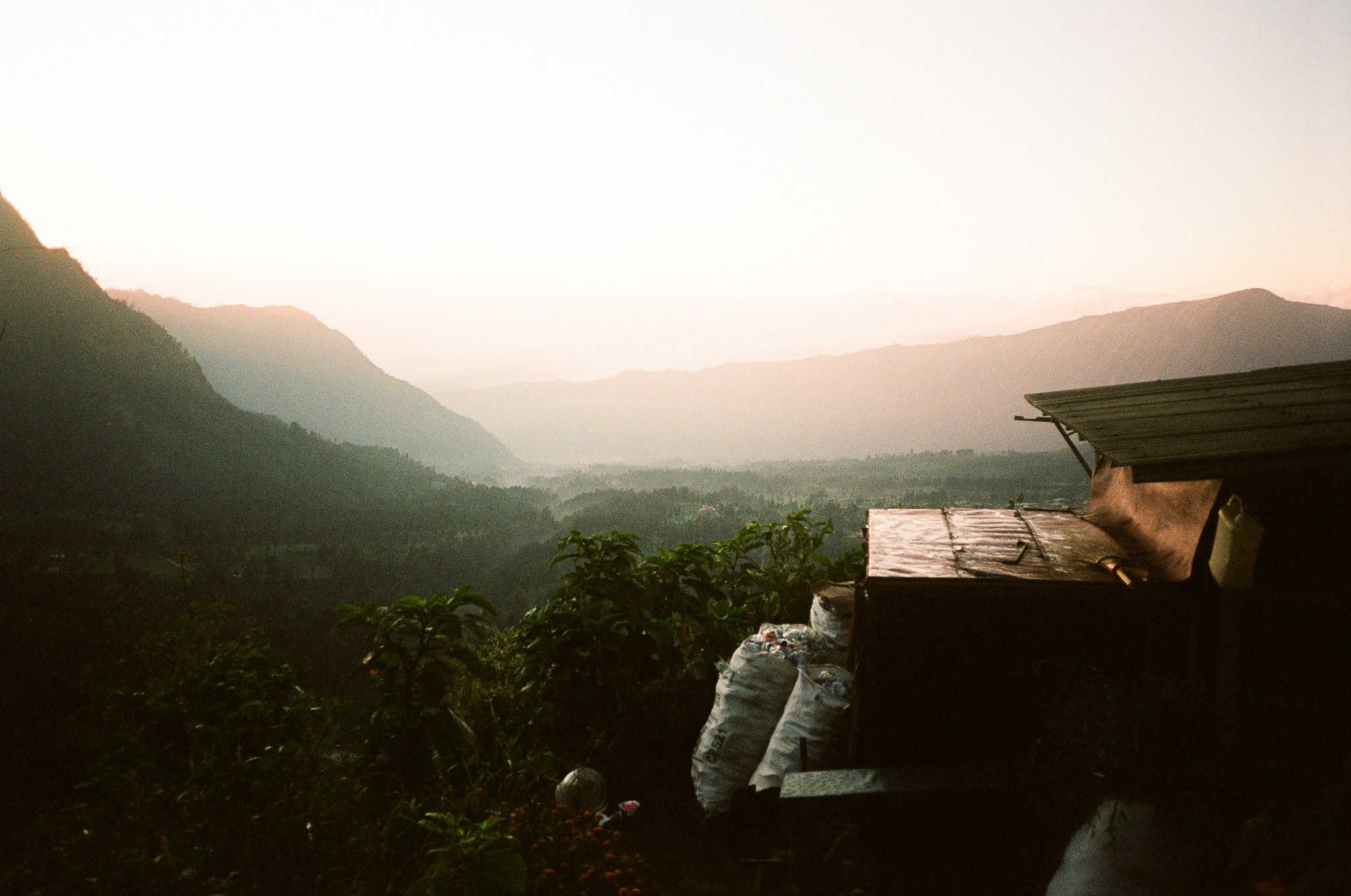Echoes of Bromo - Mountain Landscape with Shed and Sacks