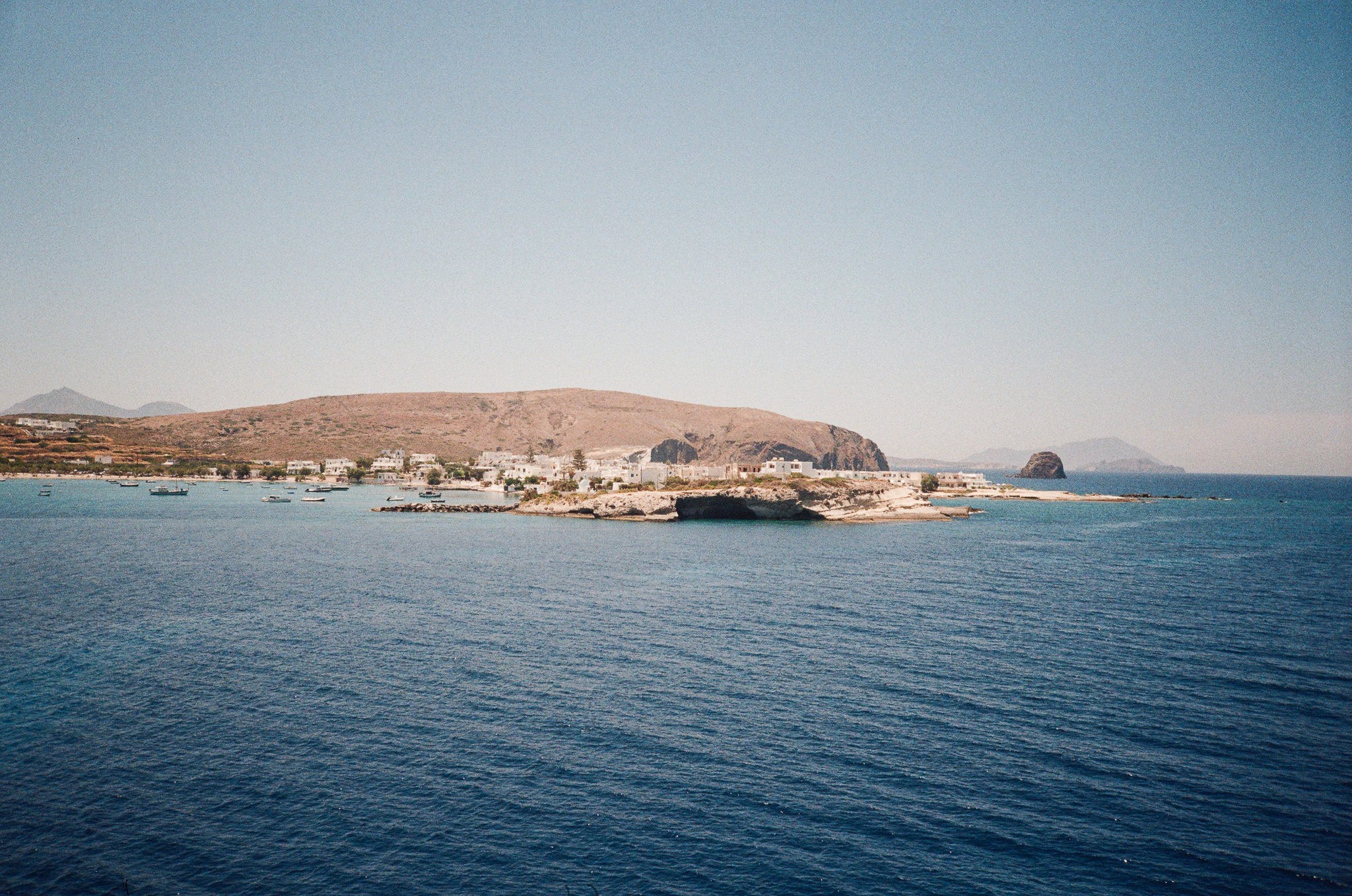 Stories of Greece - Greek Island Harbor with White Village and Blue Water