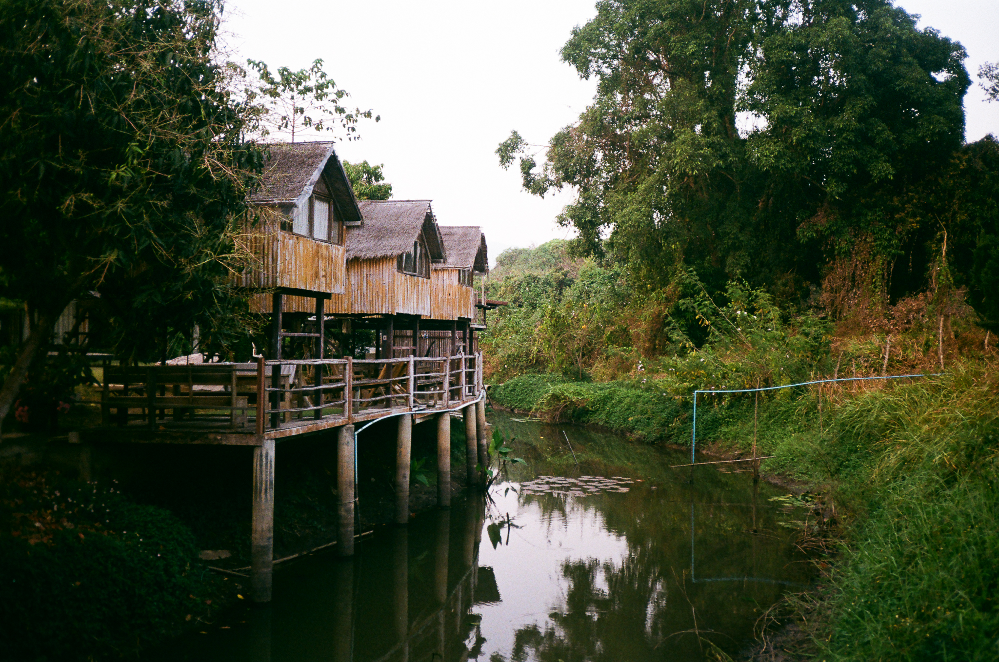 Golden moments in Thailand - Stilt Houses on Calm Water Canal