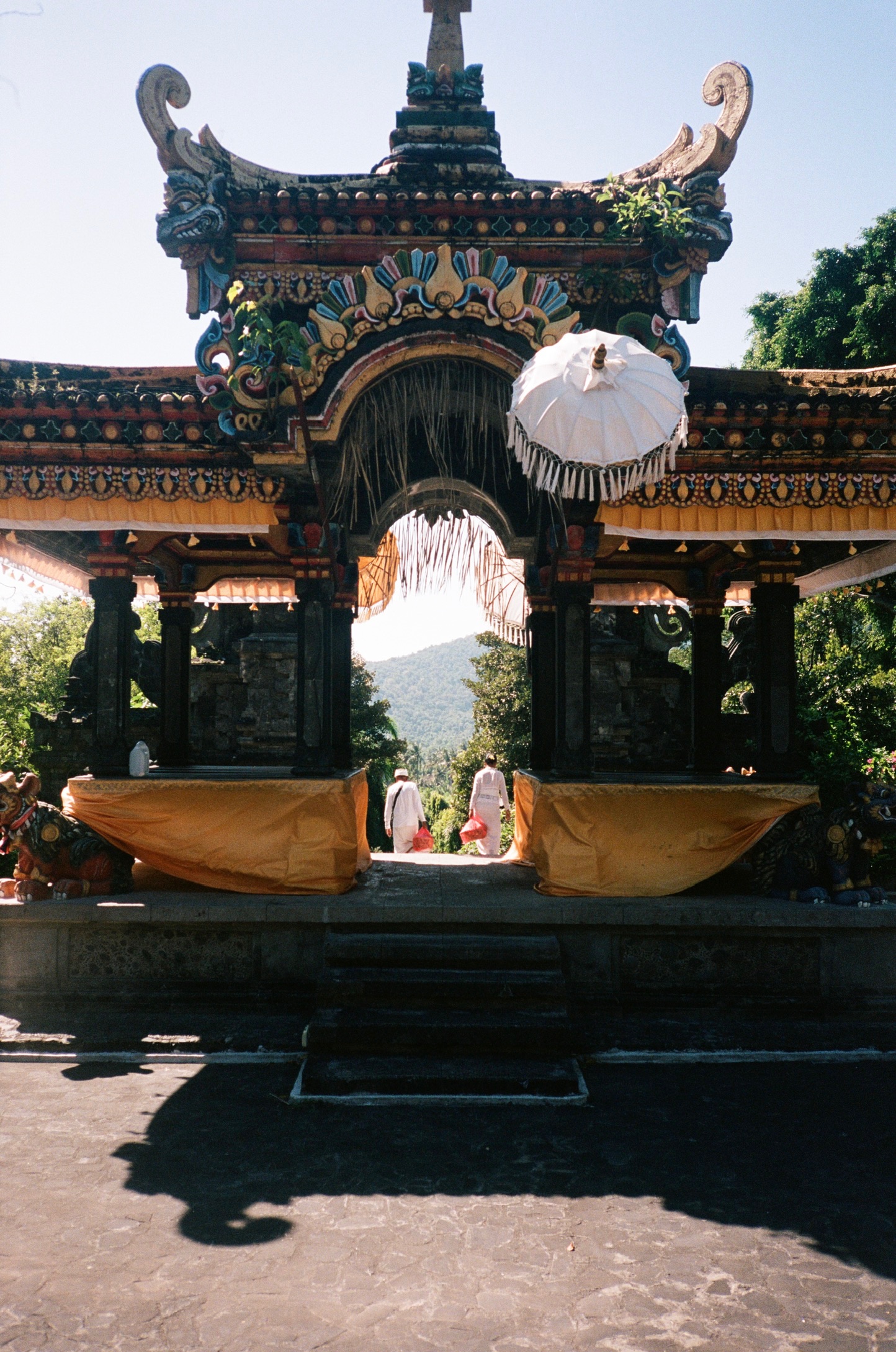 Balinese Ceremony - Temple Gate with Orange Cloths and White Umbrella