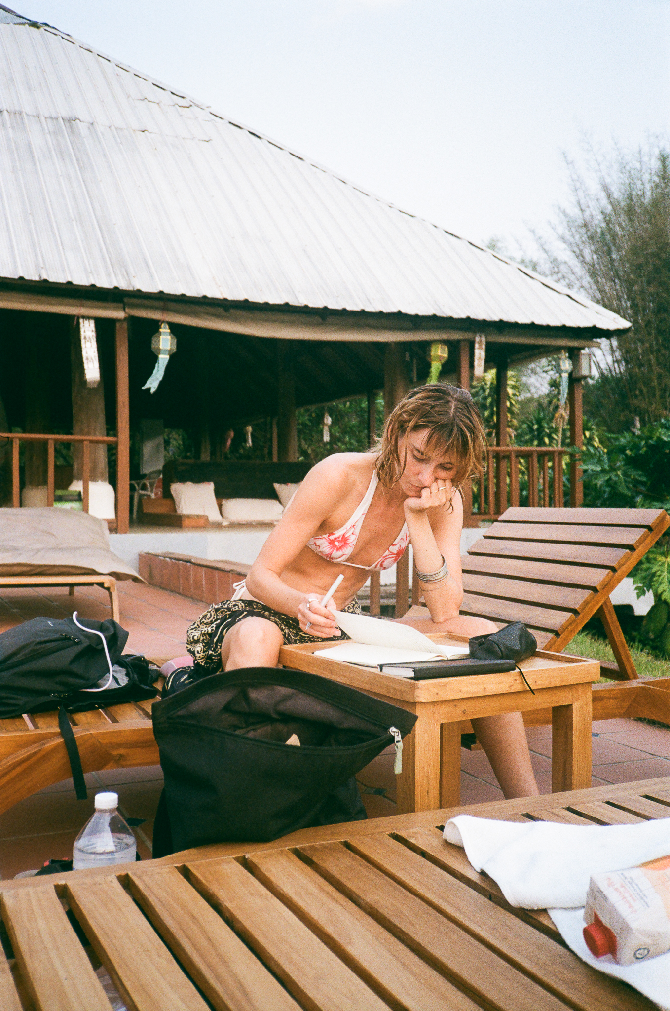 Golden moments in Thailand - Woman Writing Notebook at Dusk