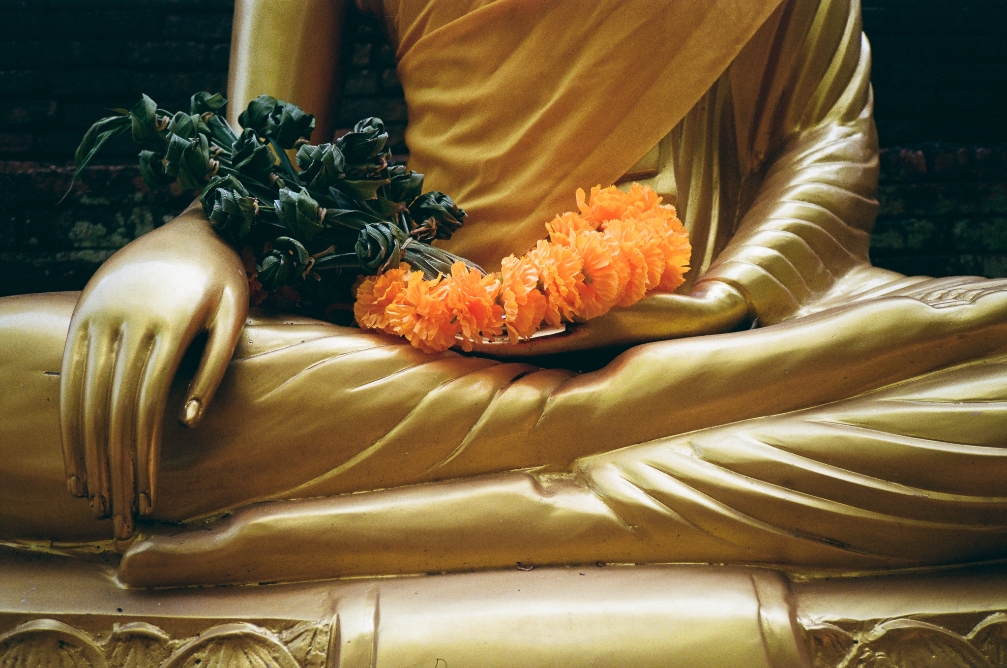 Golden moments in Thailand - Golden Buddha Hands with Flowers