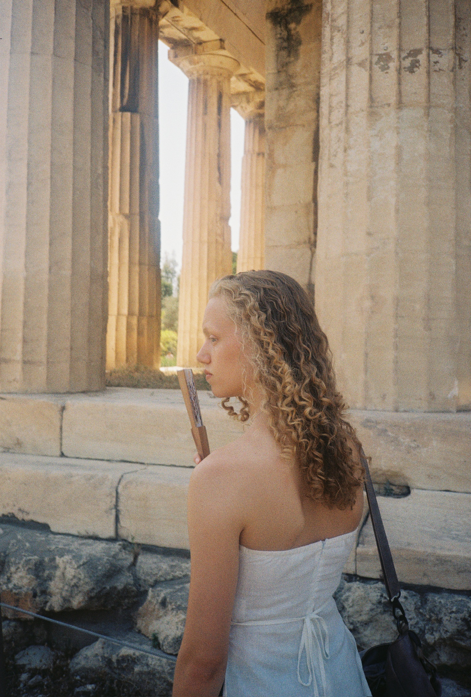 Stories of Greece - Woman with Curly Hair by Temple Columns