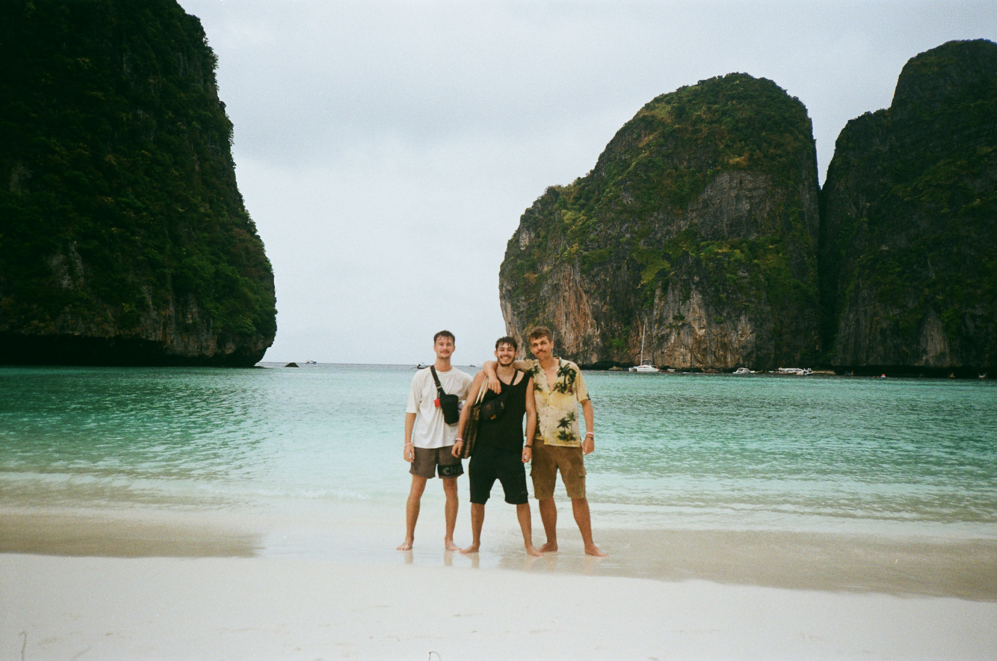 Golden moments in Thailand - Three Friends on Tropical Beach with Limestone Cliffs