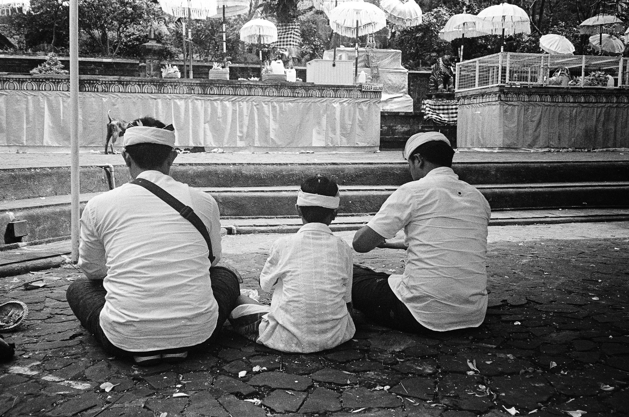 Island of the Gods - Three Men Sitting at Ceremony B&W