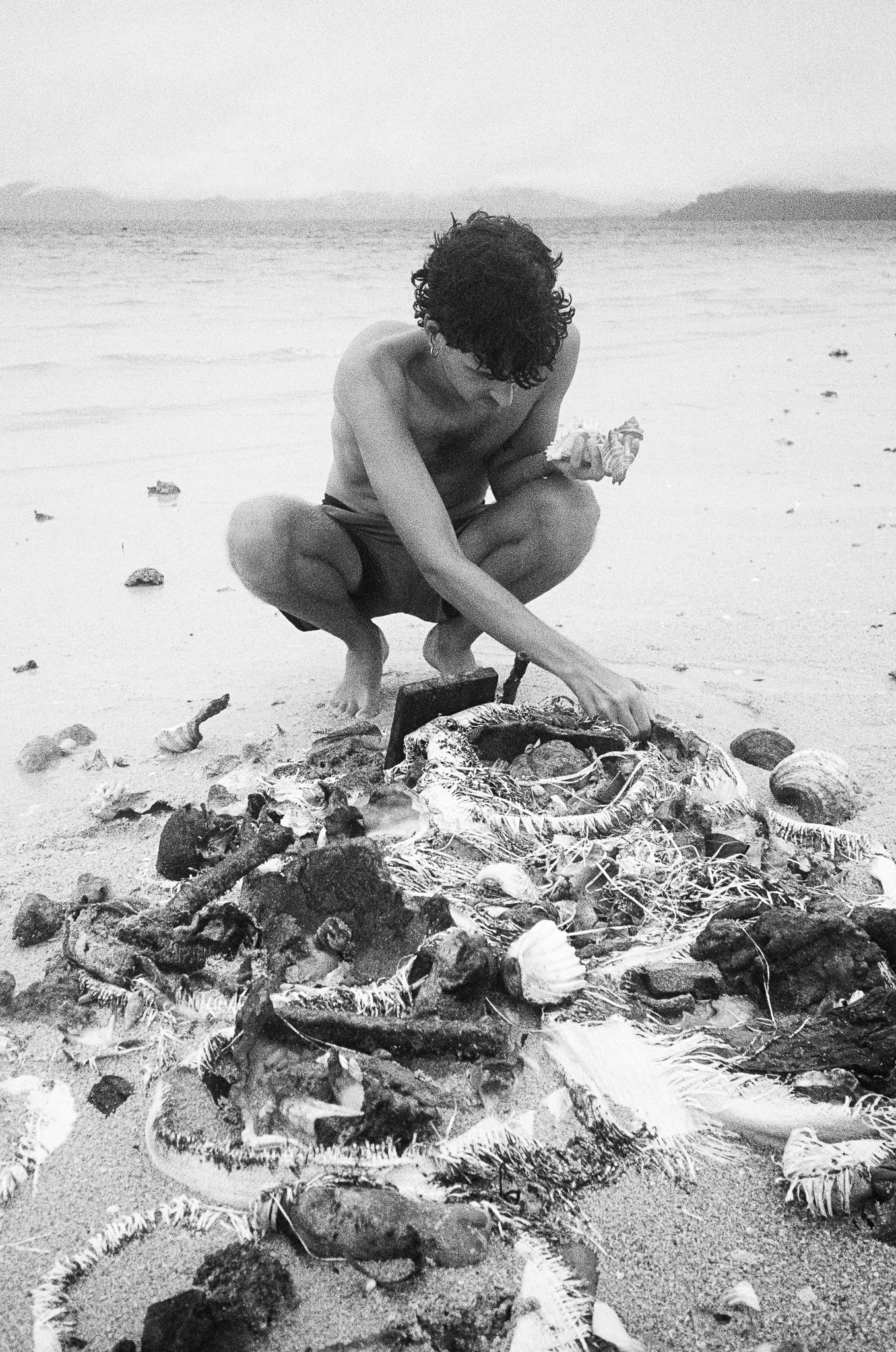 People of the Sea - Man Sorting Catch B&W