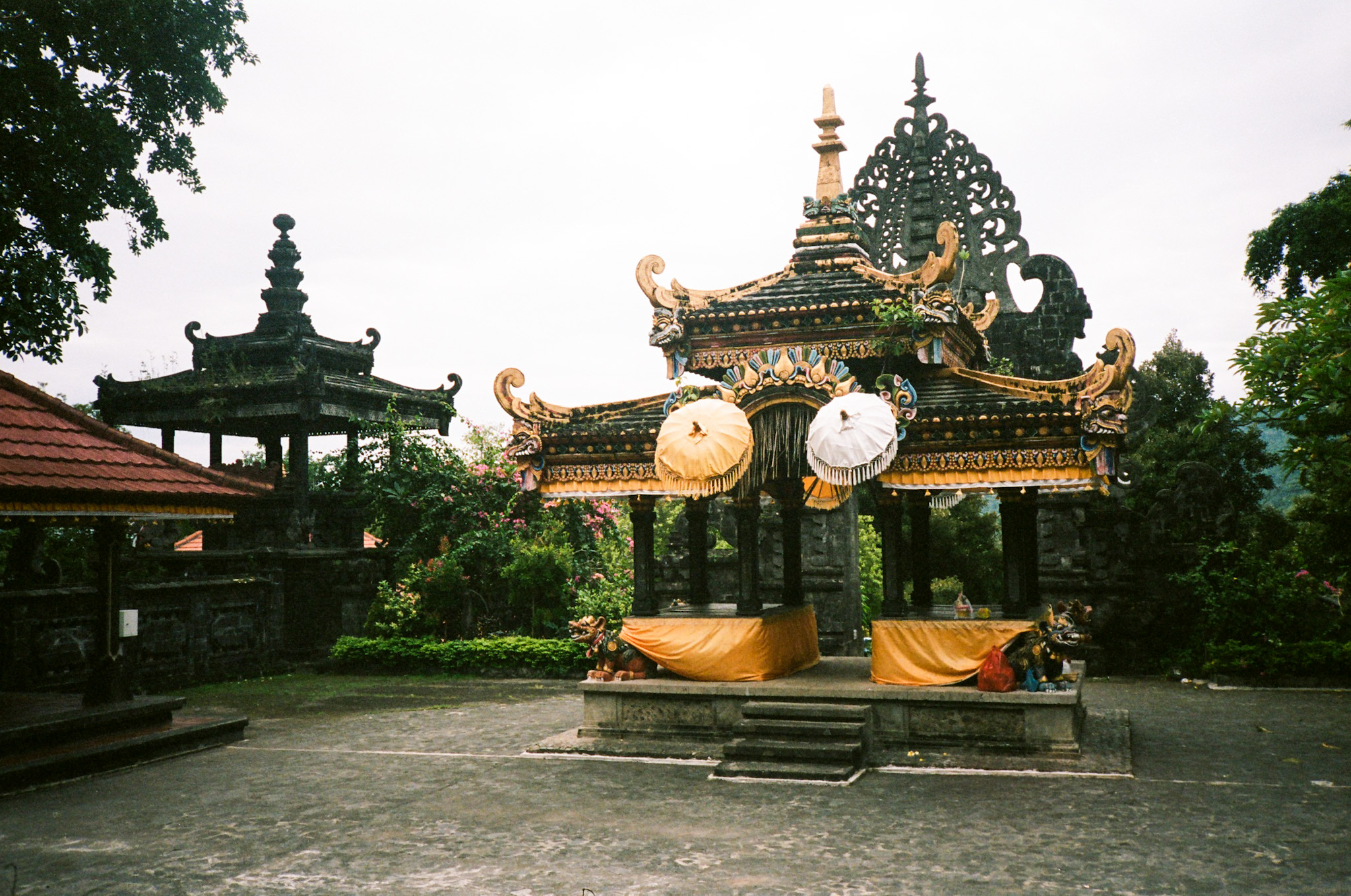 Balinese Ceremony - Temple Courtyard with Orange Cloths and Umbrellas