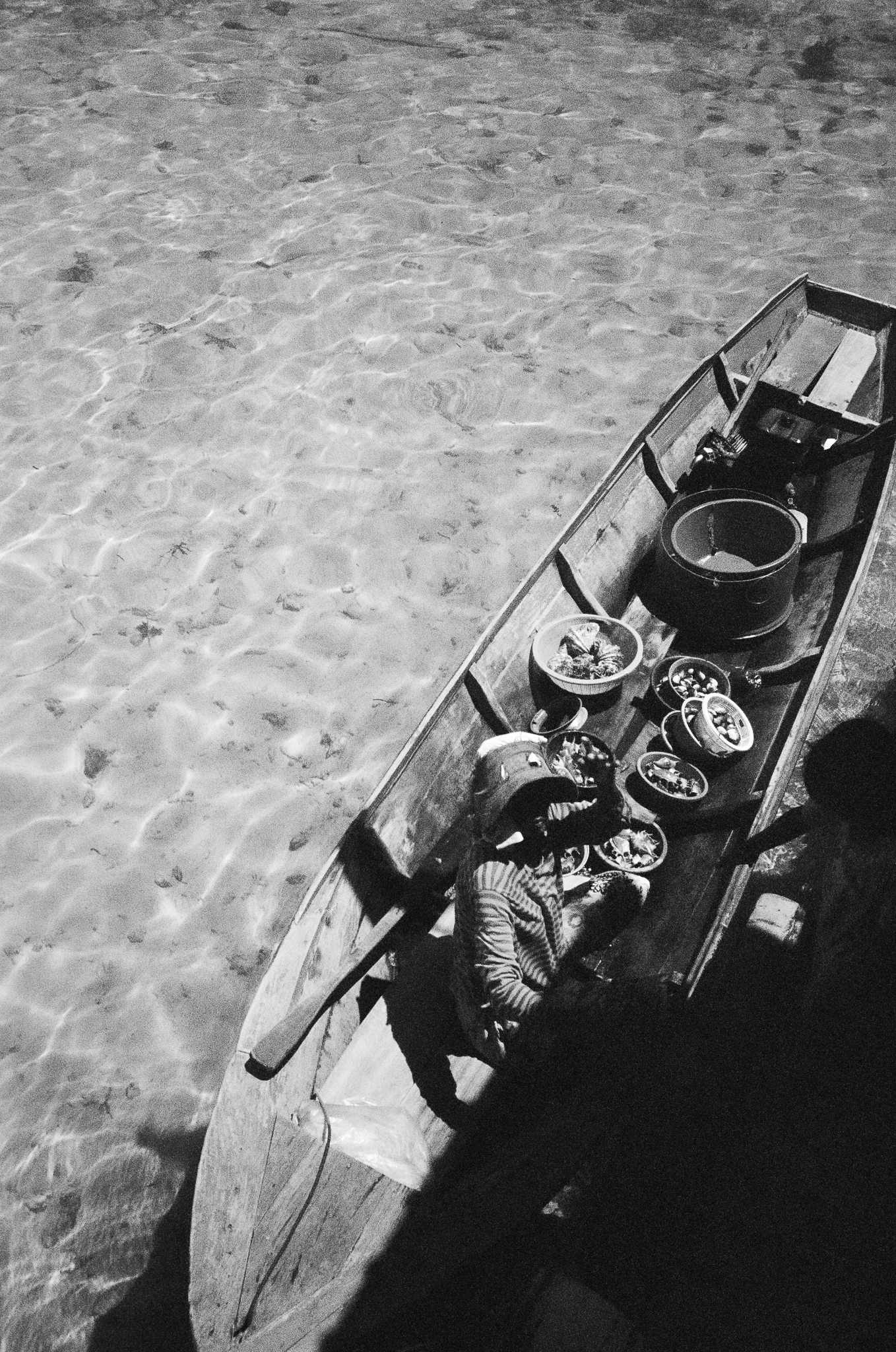 People of the Sea - Woman with Bowls on Boat