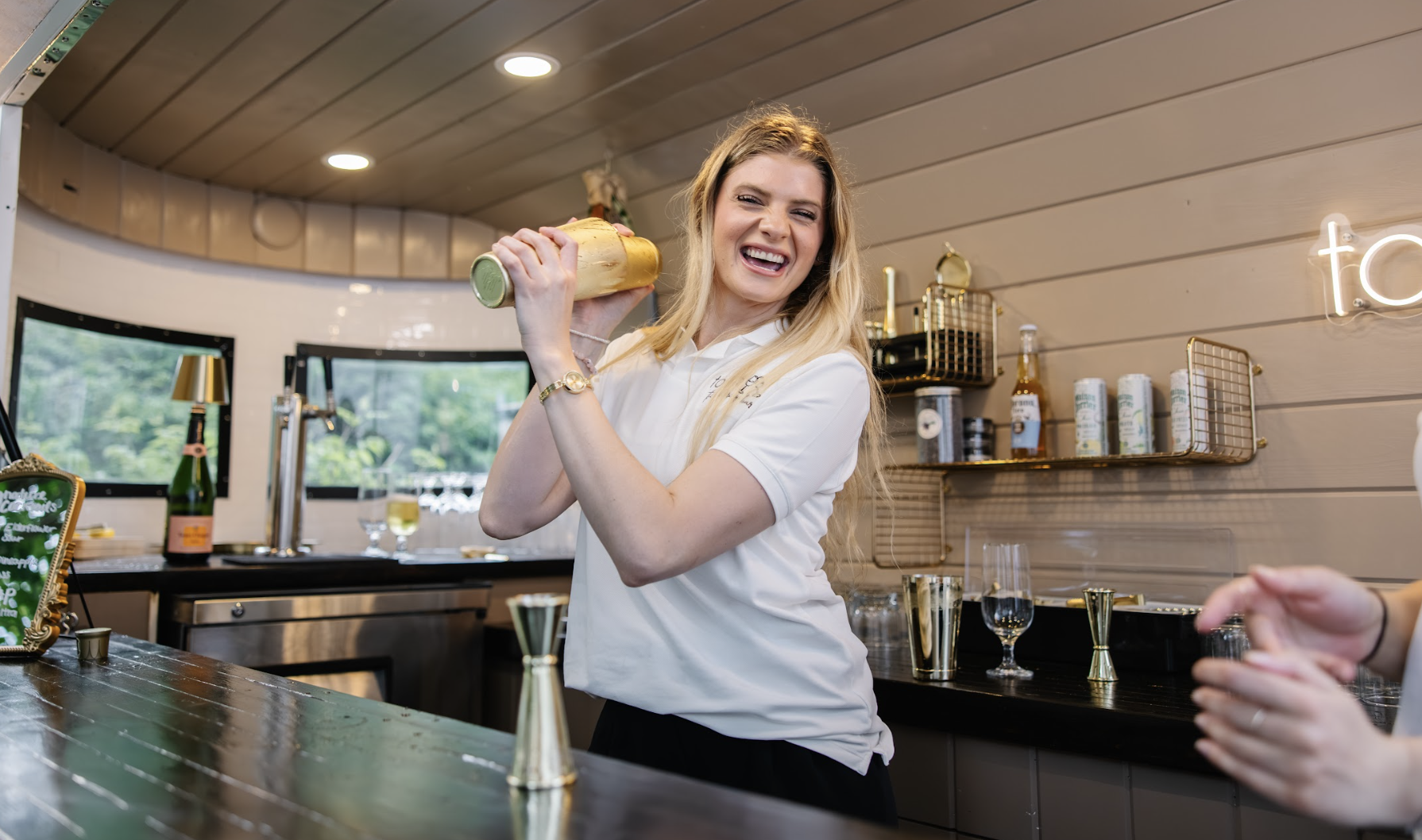 Bartender smiling inside the wandering bar