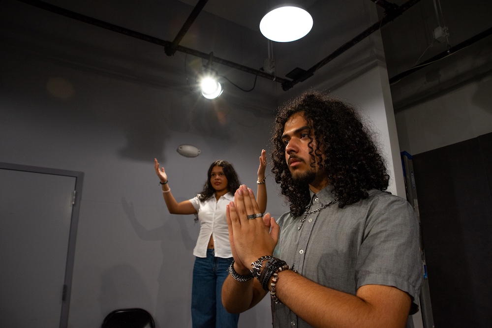 Students rehearsing on stage