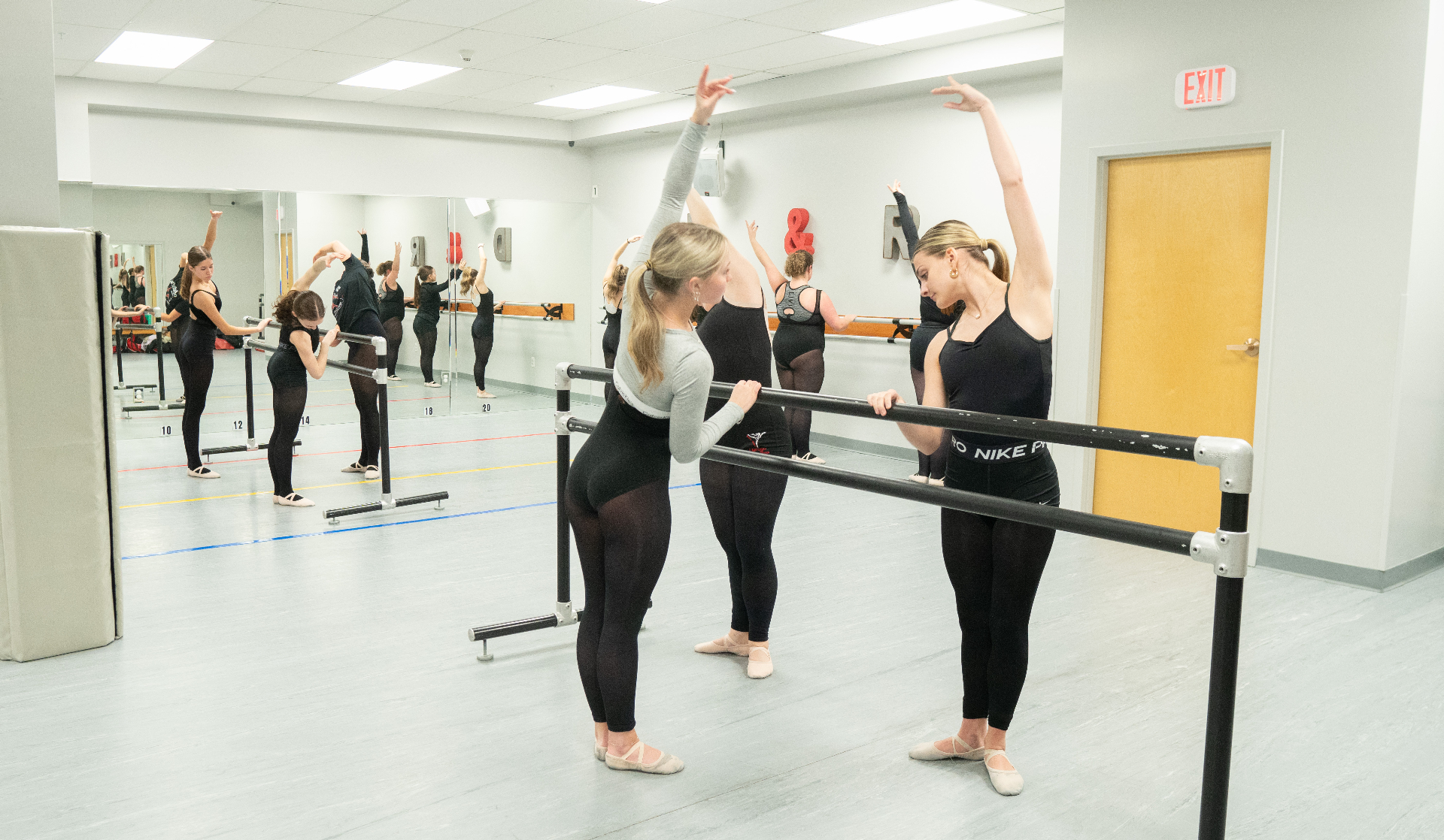 Teen ballet students practicing at the barre at Danc'letics in Rochester, NY