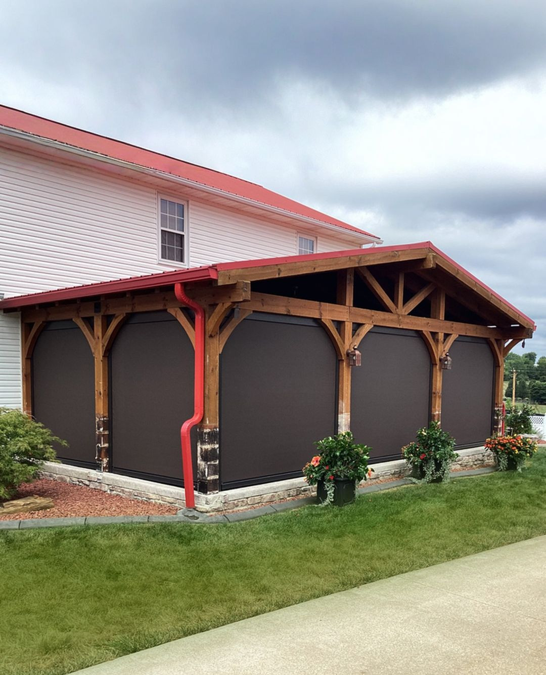 Fenetex motorized screens on outdoor pergola structure