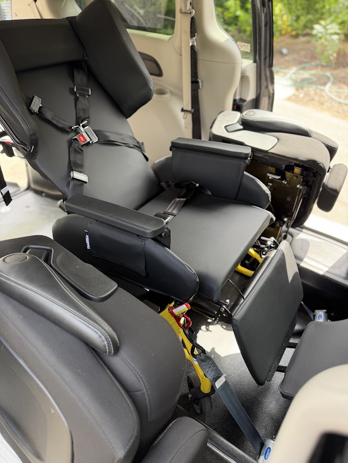 Specialized medical transport seat inside an accessible van