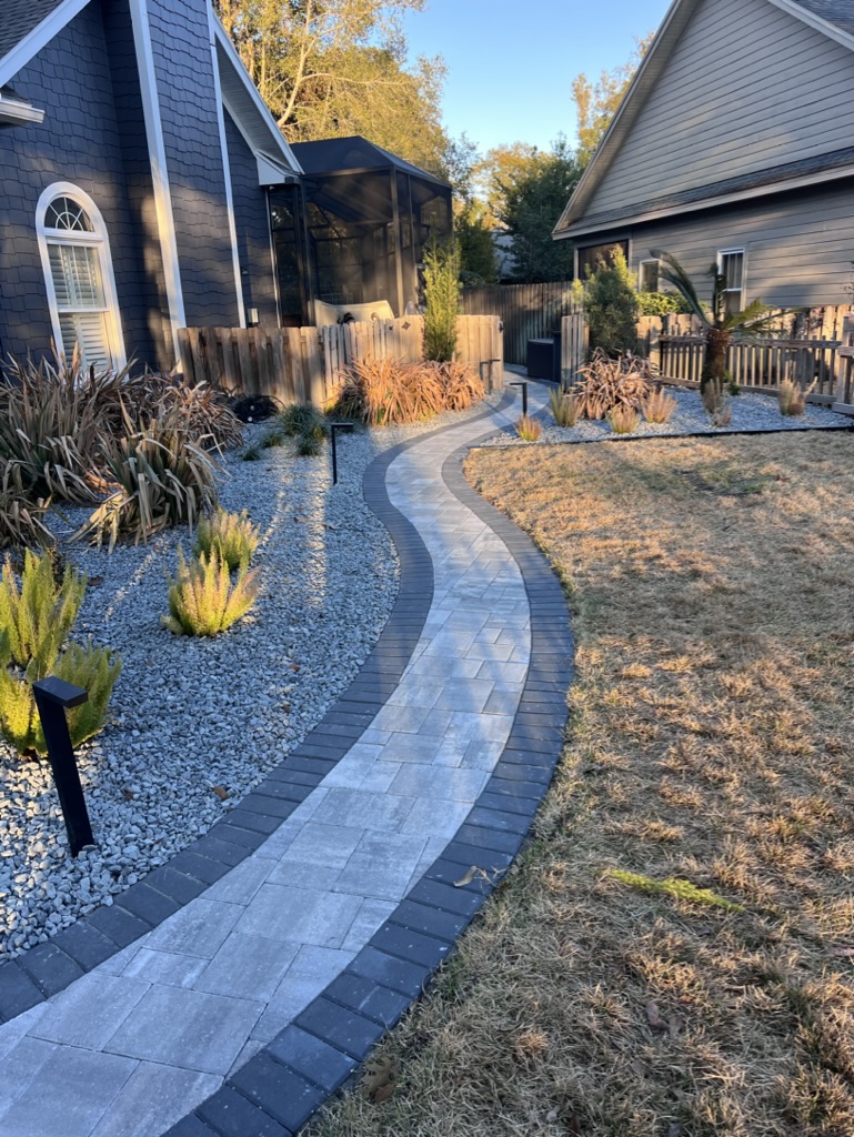 Beautiful paver walkway leading to a house