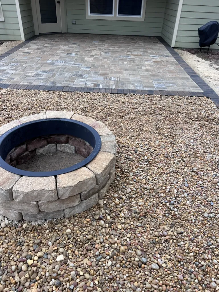 River rock bed surrounding a fire pit
