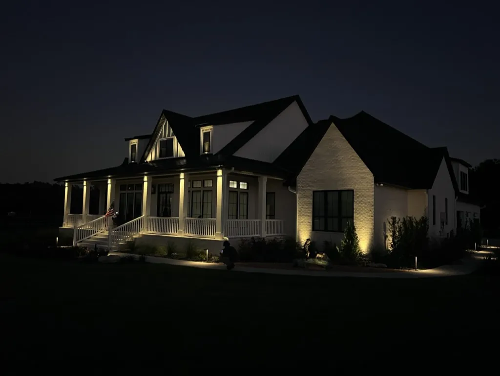 Landscape lighting accentuating a house facade