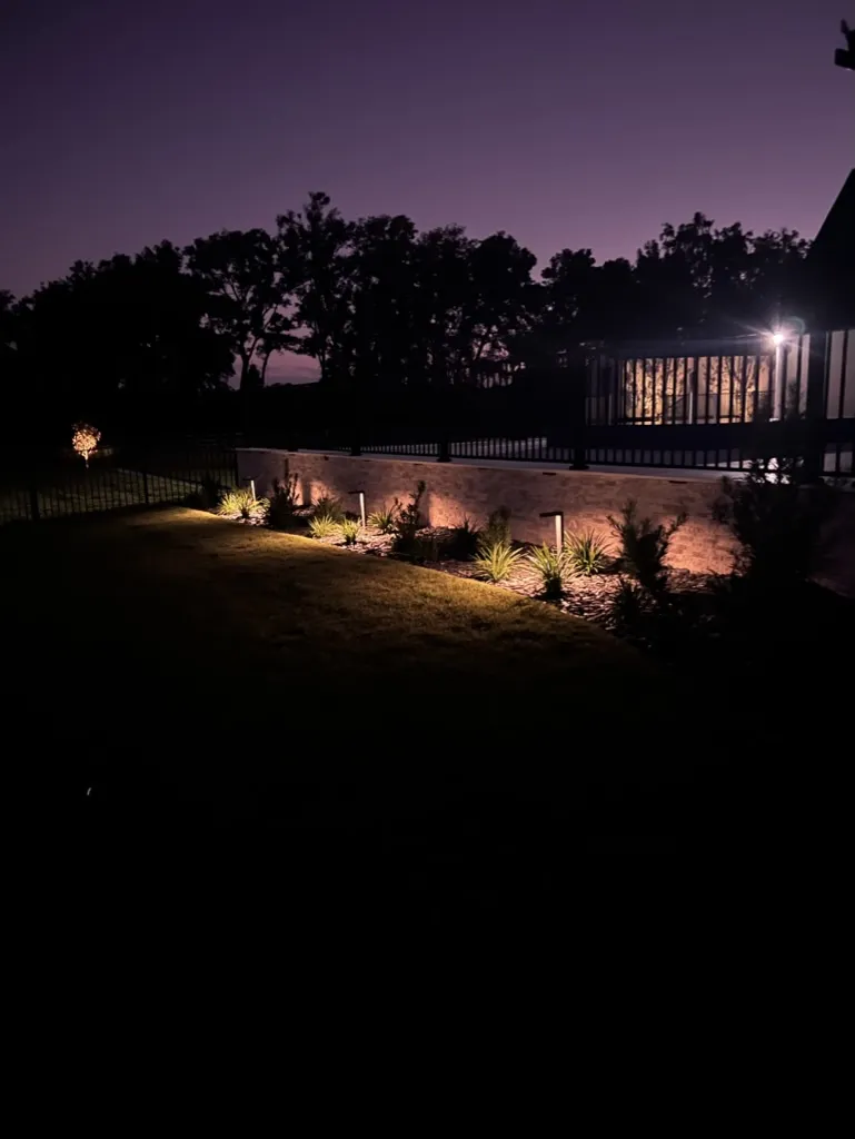 Retaining wall and garden bed with soft outdoor lighting