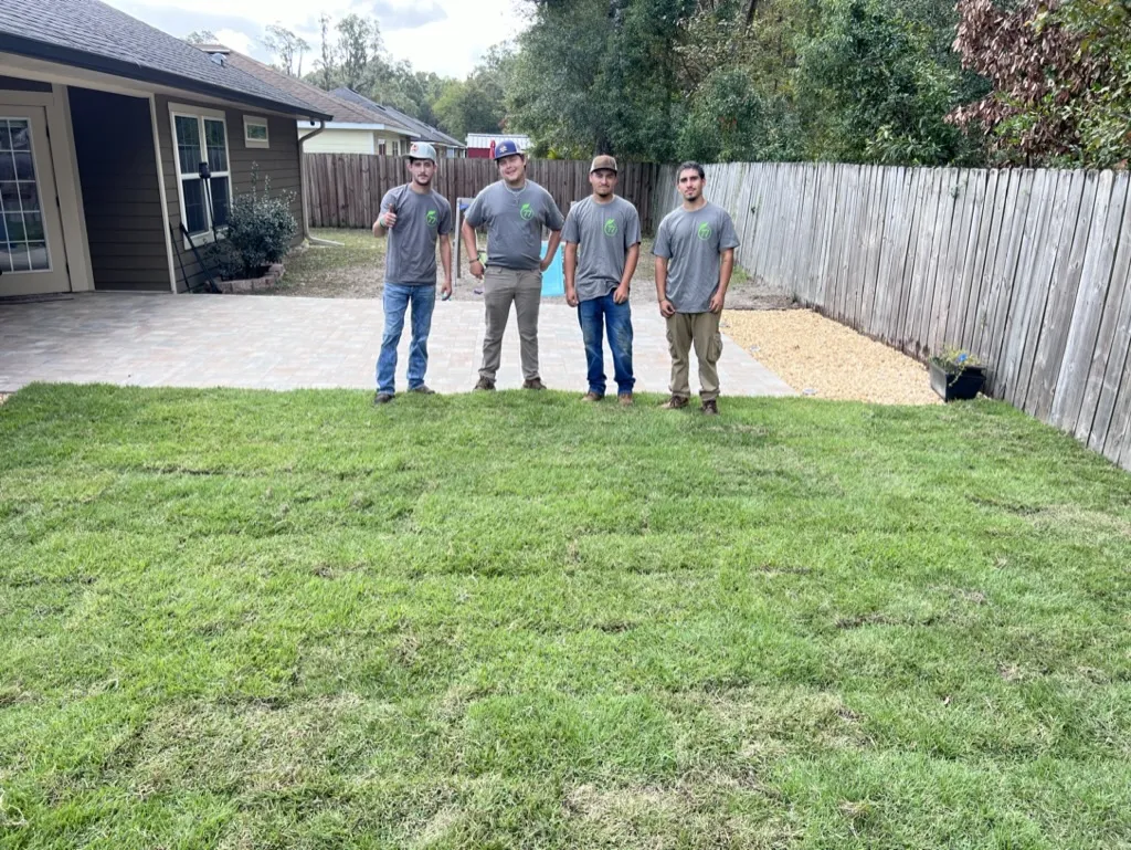 Team laying fresh sod in backyard in Alachua County, FL
