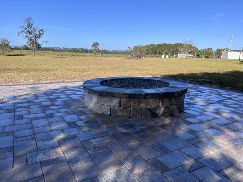 Large paver patio with built-in fire pit