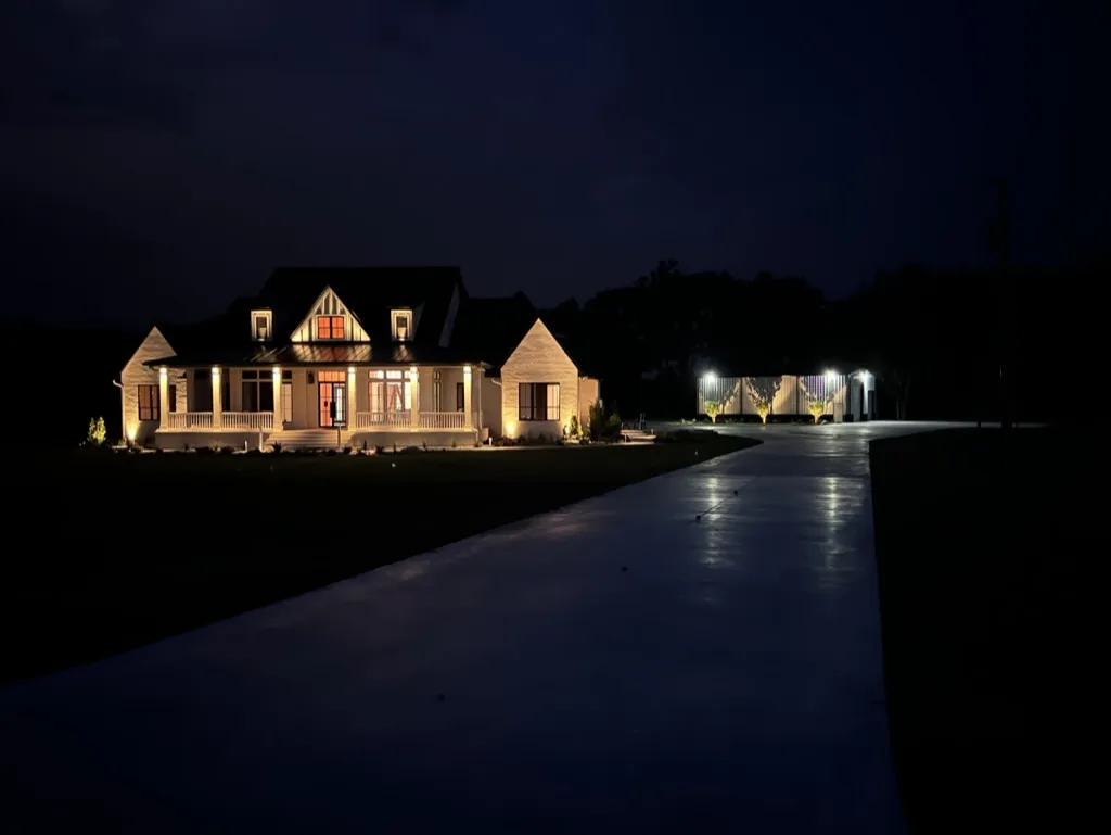 House exterior beautifully illuminated with landscape lighting