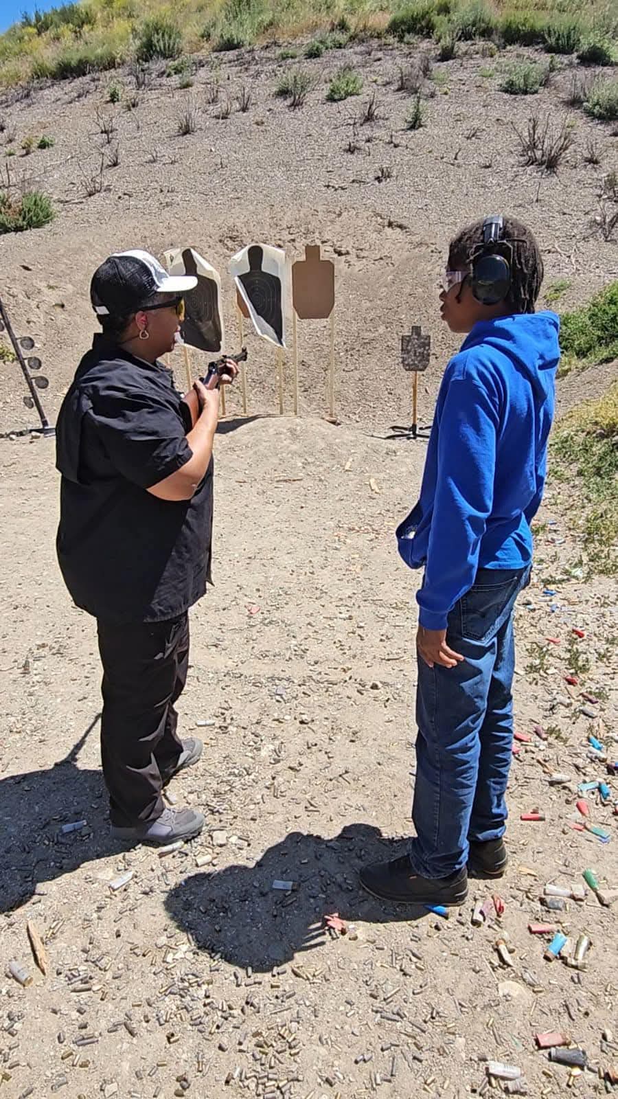 Instructor guiding shooter
