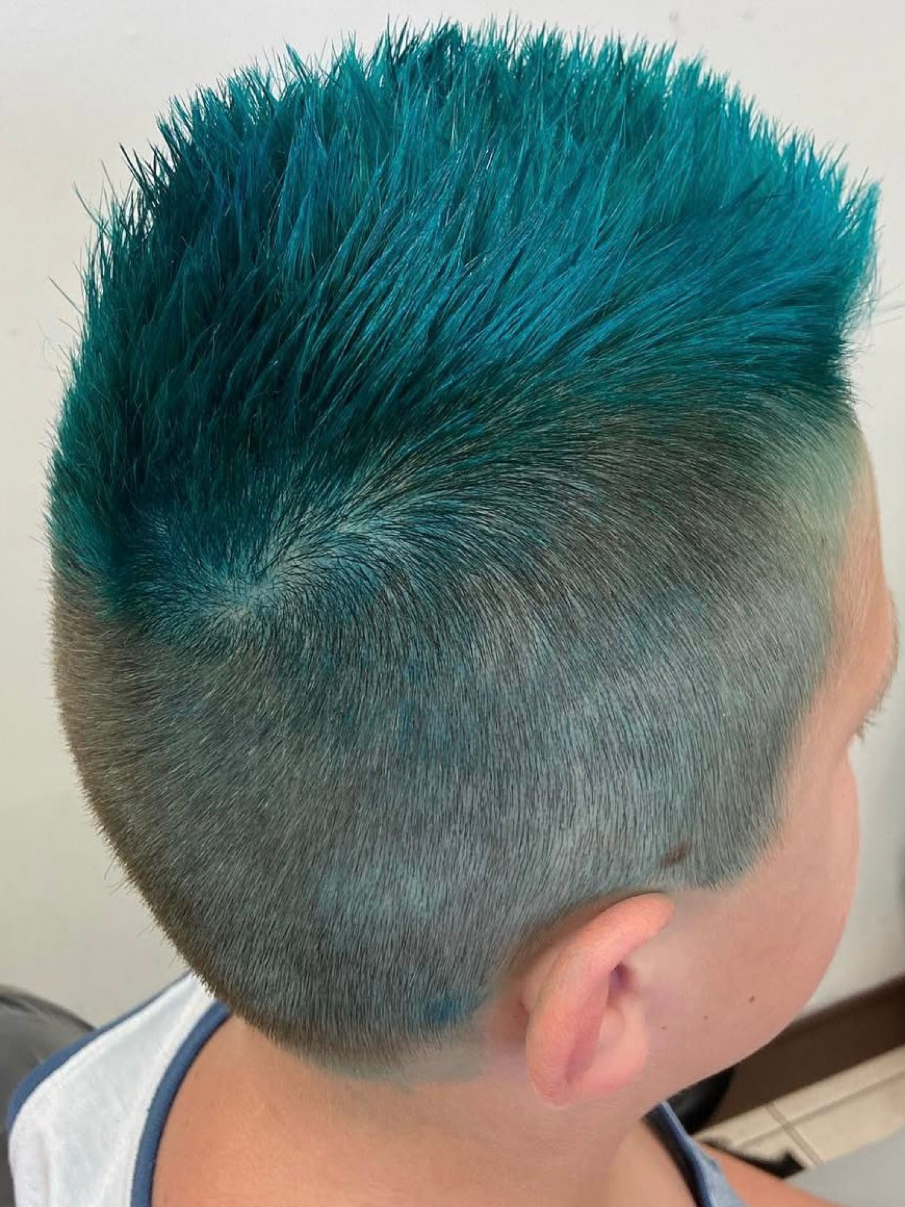 Teal vivid fashion hair color side view