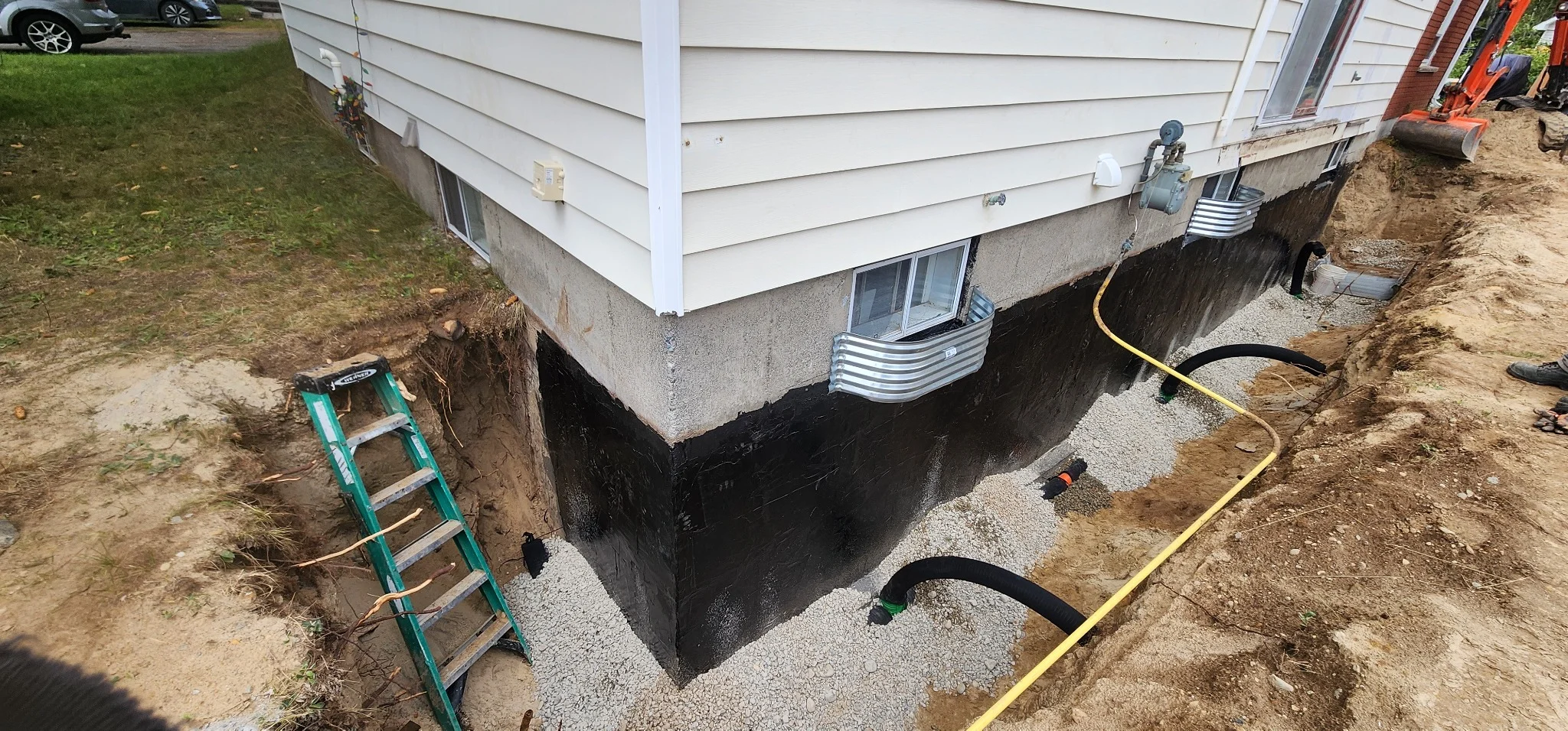 Weeping tile installation and gravel backfill