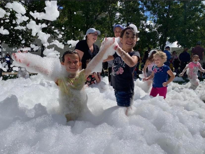 Group of kids throwing foam