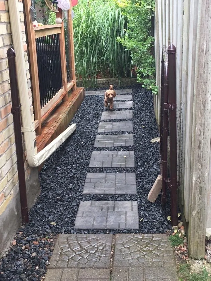 Side Entrance Stepping Stones with Black Granite Groundcover