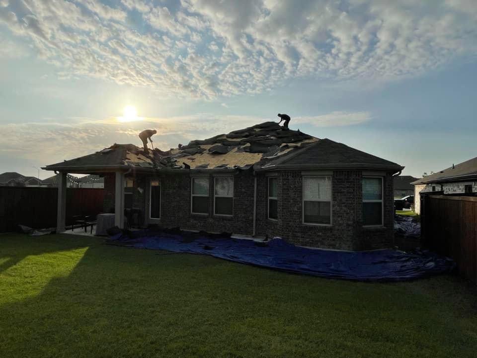 Roofers working on a residential roof