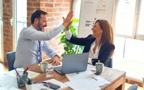 Colleagues high-fiving