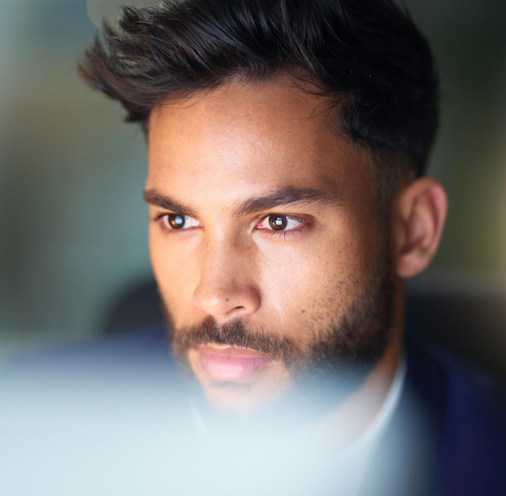 Thoughtful man looking at screen