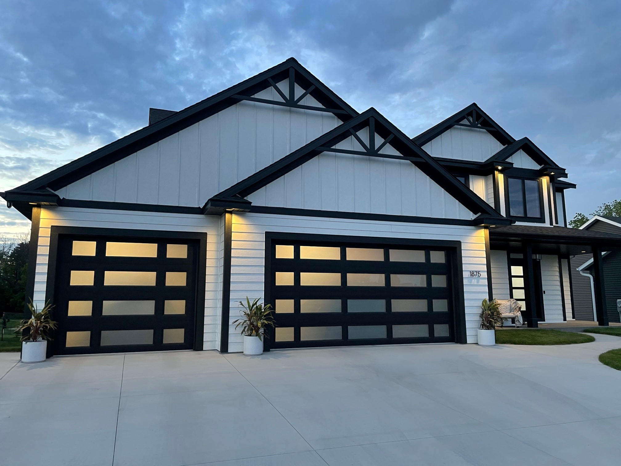 Custom Raynor garage door installation on a modern home