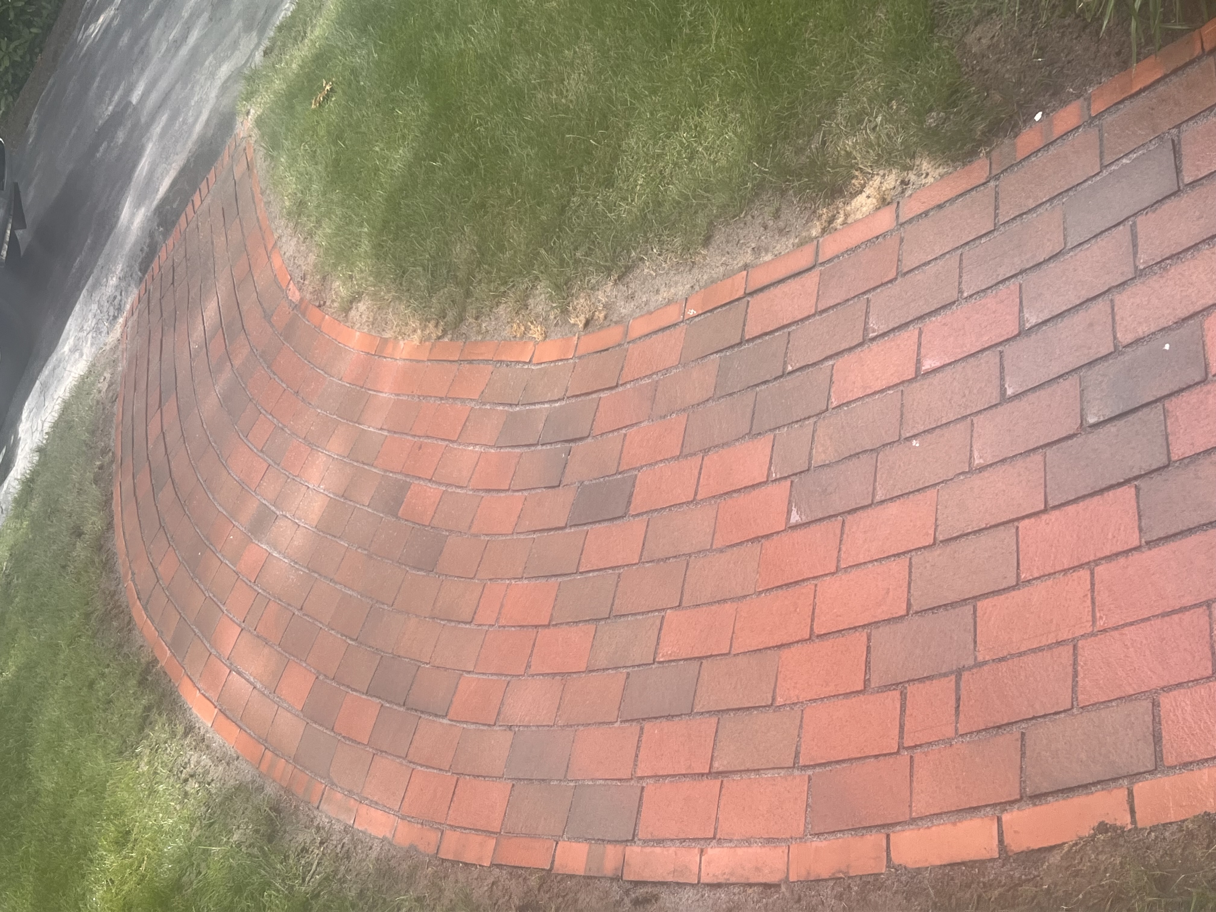 Custom curved brick paver walkway installation