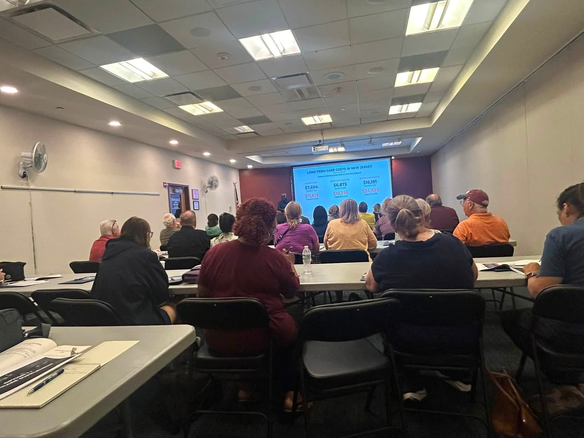 Full classroom of local seniors attending an in-person Senior Health Stop Medicare seminar