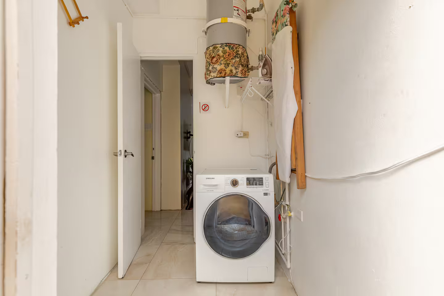 Dedicated Laundry Nook with In-Unit Front-Load Washing Machine & Ironing Station