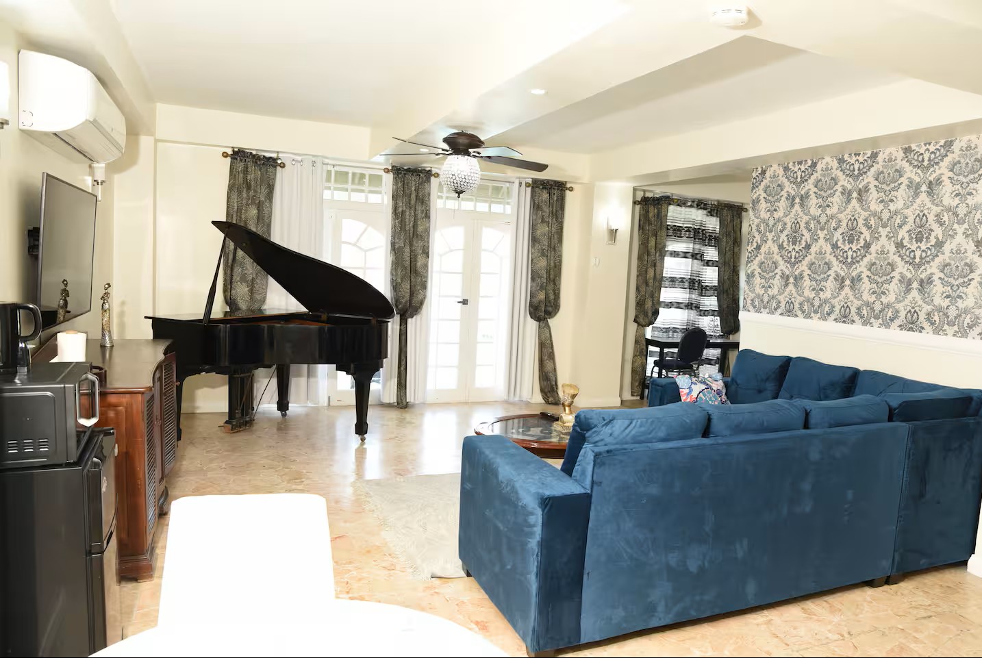 Expansive Living Area Overlooking Grand Piano & Garden Patio Doors
