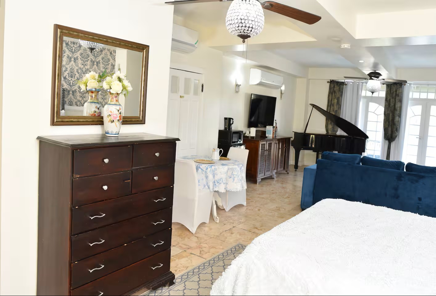 Master Suite View towards Dining Table, Grand Piano & Lounge