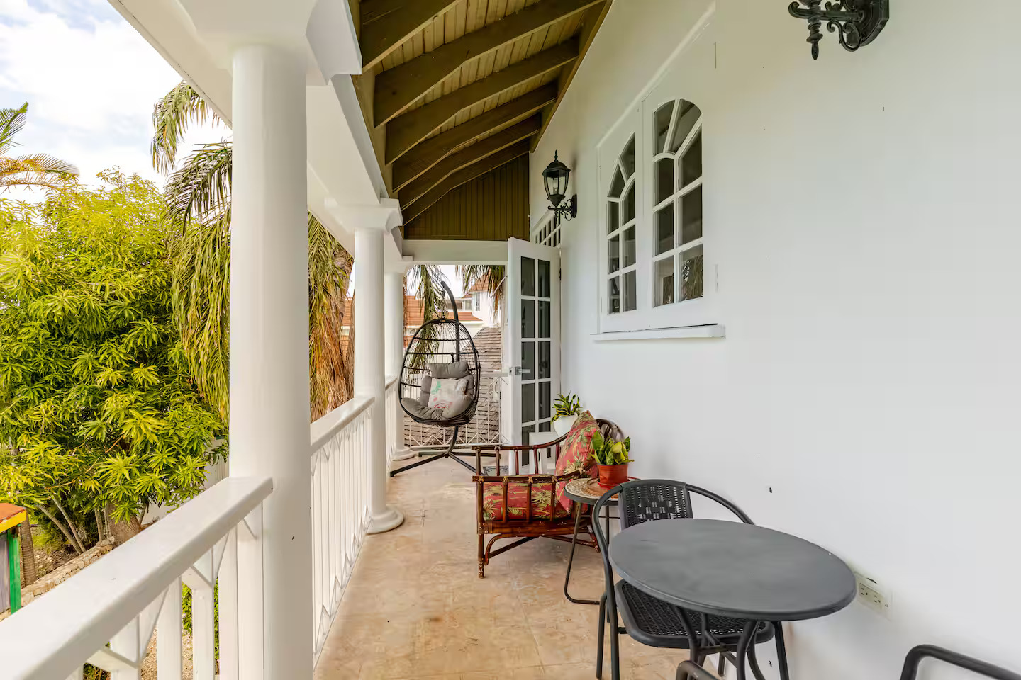 Spacious Covered Veranda with Hanging Egg Chair & Bistro Seating
